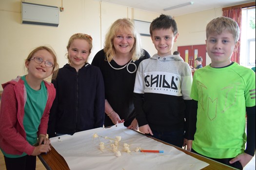 Joyce with primary school children, participating in the workshops